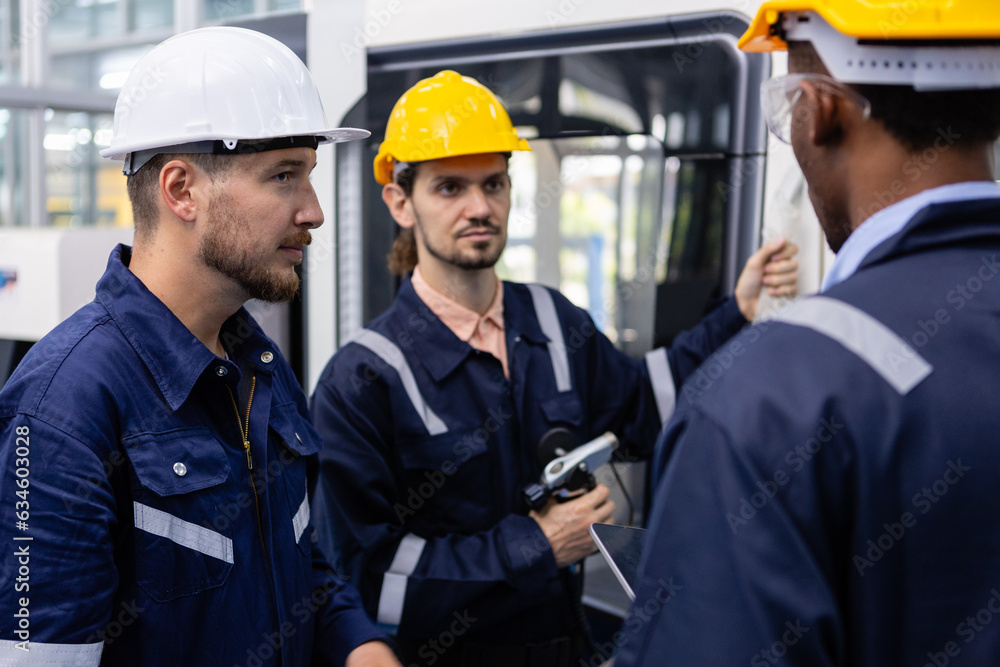 Teamwork engineers wear helmets safety brainstorm at factory workshop ...