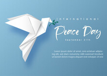 Peace Dove In Origami Paper Cut Style On Global With Wording Of The Peace Day, Example Texts On Blue Paper Pattern Background.
