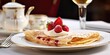 Crepe, a delicate, thin pancake folded into a triangle, served on a dainty plate in a charming café, capturing the essence of French sophistication 🥞🇫🇷🍓 