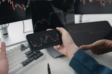 Two stock investors with stock market graph screen, stock fluctuation analysis, business man trading stocks for profit, stock market fluctuation graph screen, profit trading analysis.