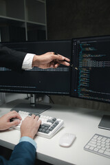 group of programmers brainstorm together to write programs on the computer, designing programs to me