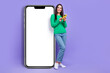© deagreez - Full body photo of businesswoman stand near big smart phone browsing searching network new device isolated purple color background