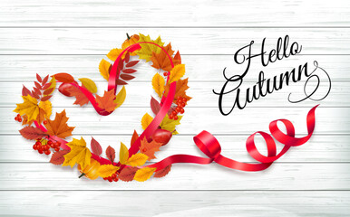 Aufkleber - Autumn colorful forest leaves and a red berries the shape of a heart and red ribbon on wooden background. Sale Frame. Vector illustration.