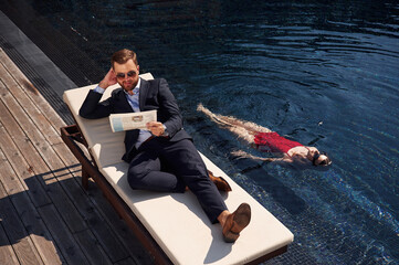 Man with woman is in the pool together