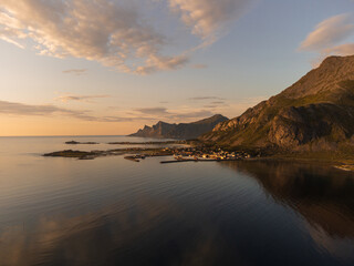 Wall Mural - Aerial view over Ramberg, northern Lofoten, Norway. Mountains, sea, reflections, cloudscape.