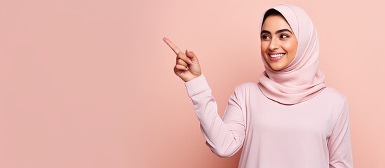 Poster - Confident Arab woman pointing in multiple directions smiling over pink background for advertisement