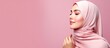 © HN Works - Curious Muslim woman in headscarf interested Arab female wearing hijab pink studio background with copy space
