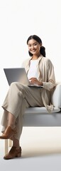 Wall Mural - Asian woman sitting on chair using laptop isolated on white with copy space