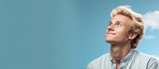 Poster - Blond man daydreaming and seeking inspiration gazing into empty space