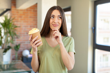 Poster - smiling with a happy, confident expression with hand on chin. take away coffee concept