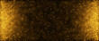 Gold particles abstract background with shining golden floor particle stars dust.Beautiful futuristic glittering in space on black background.