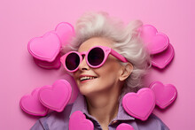 Old woman in pink glasses with pink heart