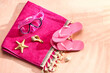 Leinwandbild Motiv Female stylish flip flops with beach blanket and snorkeling mask on grunge pink background