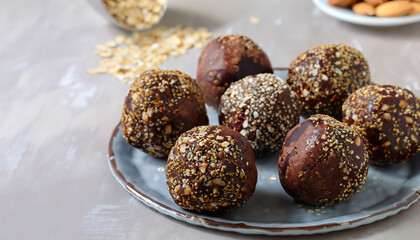 Wall Mural - Healthy homemade paleo chocolate energy balls with rolled oats, nuts, dates and chia seeds, horizontal, copy space