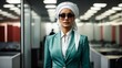© Usman - A woman wearing a hijab in a stylish green suit and white headscarf