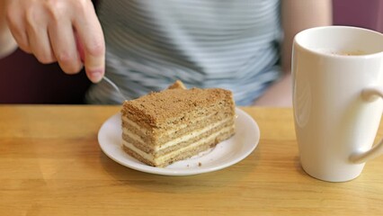 Canvas Print - Footage of eating honey cake and drinking coffee in the cafe