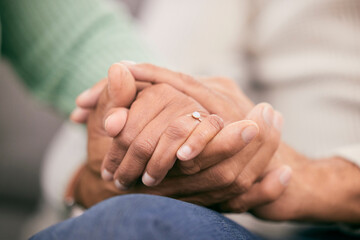 Canvas Print - Couple holding hands for support, love and care of trust together in marriage relationship at home. Closeup of man, woman and helping hand of life partner with loyalty, commitment or hope for empathy