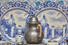 Antique Blue Procelain Delftware And Tin Can In The Ancient City Center Of Deventer, The Netherlands