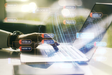 Wall Mural - double exposure of abstract programming language hologram with world map and hands typing on laptop 