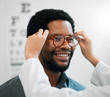 © Mumtaaz Dharsey/peopleimages.com - Black man, glasses and hands, vision and eye care, test and optometry with health and smile. Prescription lens, frame choice and healthcare, eyewear and optometrist with wellness and medical service