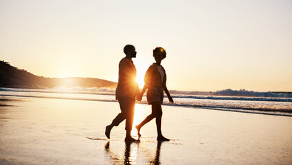 Canvas Print - Beach sunset, silhouette and couple walking, holding hands and enjoy romantic conversation, freedom and travel holiday. Love, sea and dark shadow of people bonding, talking and relax on tropical date