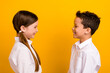 © deagreez - Profile side photo of two friends in school girl boy speaking on break isolated vibrant color background