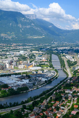 View on central part of Grenoble city from Bastille fortres witn mountains around, old cable car, Isere, France