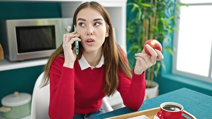 Sticker - Young hispanic woman having breakfast talking on smartphone at dinning room