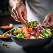 Salmon And Tuna Poke Bowl. Close Up Of Chef's Hands Cooking Poke Bowl With Tuna, Salmon, Avocado, Edame Beans, Rice And Other Sushi Bowl Ingredietns. Seafood, Menu Concept. Healthy Eating