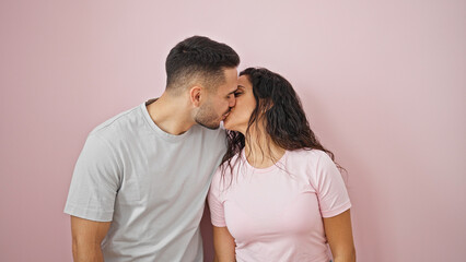 Sticker - Man and woman couple smiling confident kissing over isolated pink background