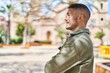 © Krakenimages.com - Young hispanic man smiling confident standing with arms crossed gesture at park