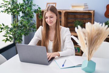 Sticker - Young caucasian woman sitting on table studying at home