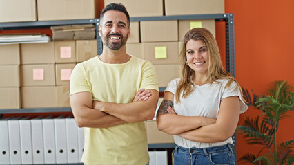 Wall Mural - Man and woman ecommerce business workers standing together with arms crossed gesture at office