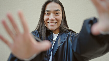 Poster - Young beautiful hispanic woman smiling confident doing frame gesture with hands over isolated white background