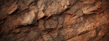 Dark Red Orange Brown Rock Texture With Cracks. Close-up. Rough Mountain Surface. Stone Granite Background For Design. Nature.