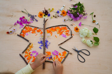 step by step tutorial butterfly made from flowers, easy nature craft for kids. step 4 from the petal