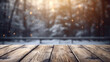 Beautiful winter snowy blurred defocused blue background and empty wooden flooring. Flakes of snow