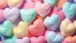Colorful heart shape cotton candy, pastel color background. Close up of  cute  cotton candy representing love and romance. Lovely valentine sweet  backdrop. Top View, From Above, Flat Lay.