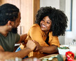© Lumos sp - woman man couple happy together hug bonding talking dating  leisure fun smiling love young home kitchen two girlfriend boyfriend date wife relationship african american romance restaurant flirting