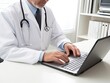 © Anna - Closeup picture of a doctor typing on laptop in his clinic office