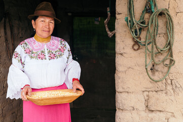 indigenous woman holding corn