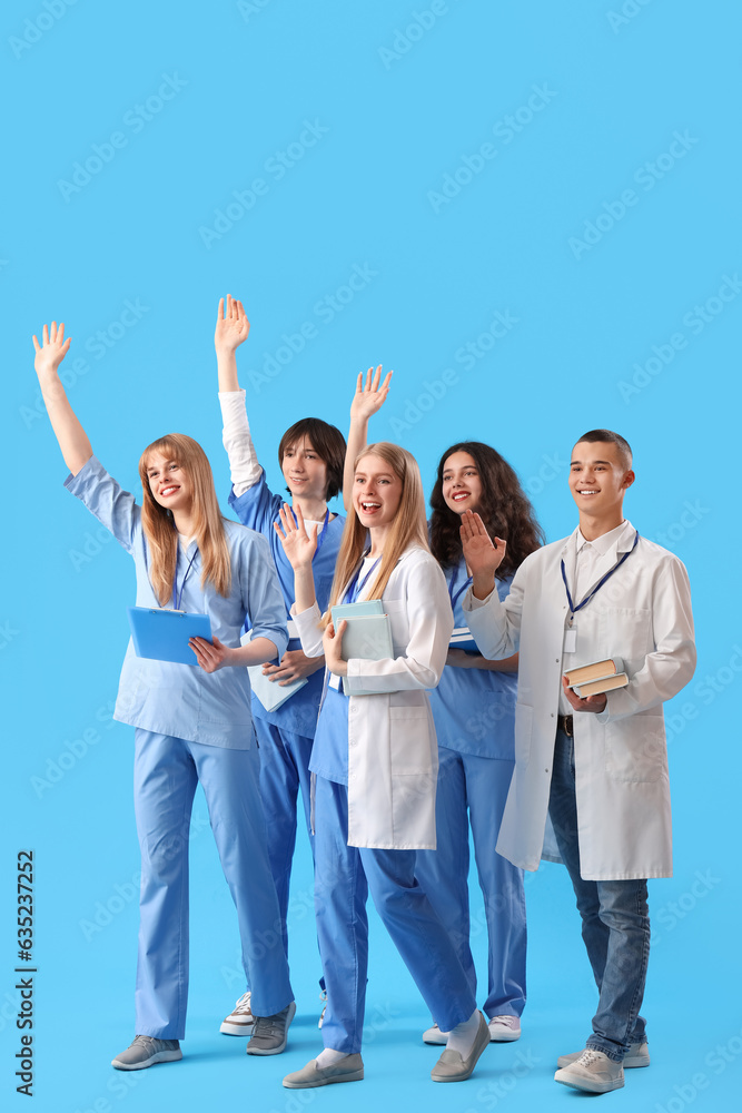 Group of medical students on blue background