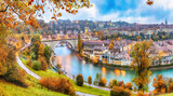 Fototapeta Natura - Amazing autumn view of Bern city on  Aare river during evening with Pont de Nydegg bridge and Nydeggkirche - Protestant church