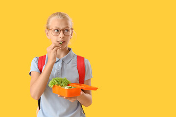 Poster - Girl in eyeglasses with backpack and lunchbox on yellow background