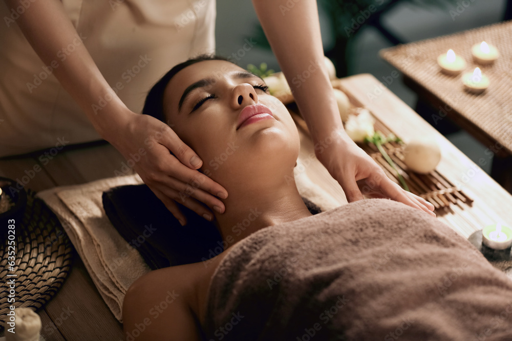 Beautiful woman receiving spa massage in salon