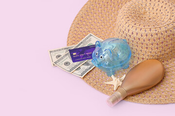 Sticker - Piggy bank with beach accessories, money and sunscreen cream on pink background. Concept of savings for travel