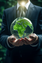 ESG Environmental Social Governance Business Strategy Investing Concept. Businessman Holding Green Earth Globe World .Ethical And Sustainable Investing. Enhance ESG Alignment Of Investments . Eco
