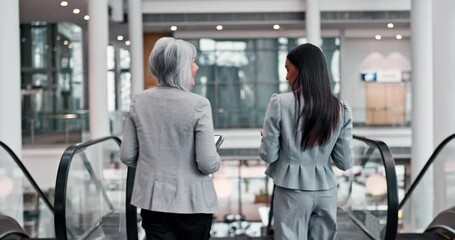 Sticker - Back, escalator and a manager talking to an employee while walking together in an office for planning. Collaboration, mentor and intern in a corporate workplace for discussion or career growth