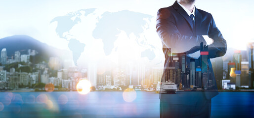 Portrait of businessman .Double exposure effect with Hong Kong city skyline business center view at sunrise .