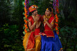 © IndiaPix - Young man and woman dressed up as Radha and Krishna and sitting together on a swing on the occasion of Janmashtami